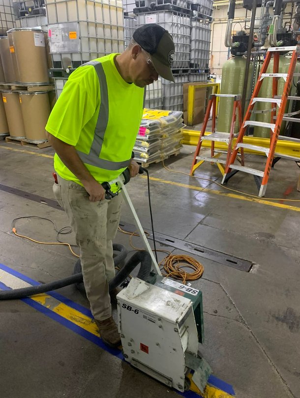 Man nail gunning window frame
