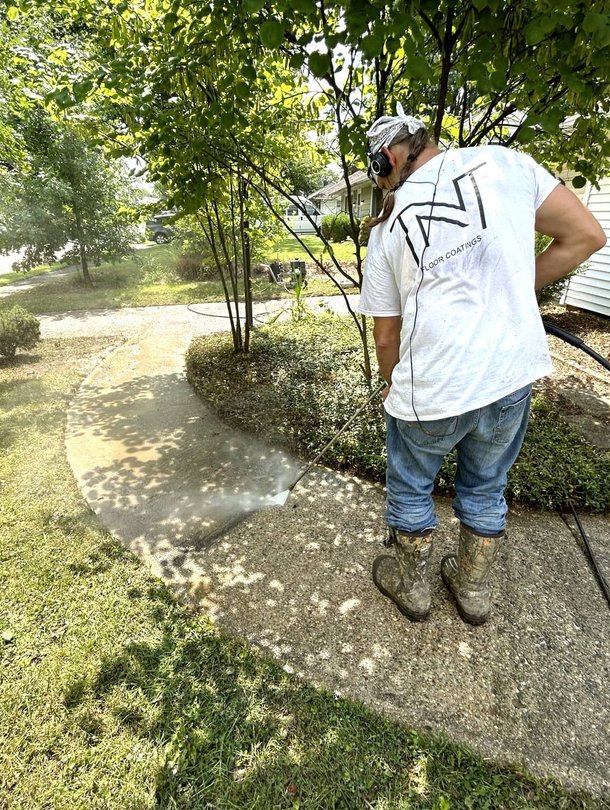 Man on roof conducting repairs